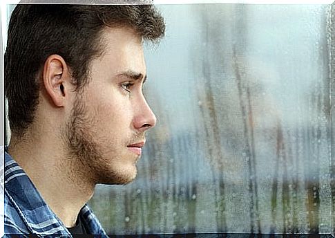 Teenager looks out the window